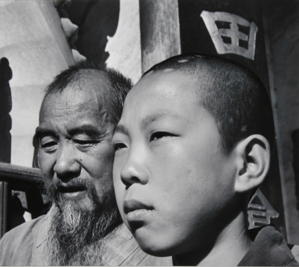 Chief Monk and Novice of a Buddhist Temple. Yunnan Province, China