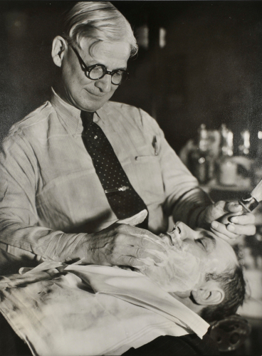 ED KEHRER SHAVING WILLIAM H. BALL IN THE TERMINAL BARBER SHOP