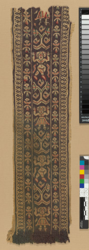 FRAGMENT OF DECORATIVE BAND OR CLAVUS WITH DANCING FIGURES AND FRINGE