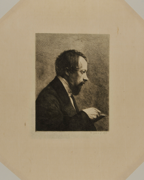 PROFILE PORTRAIT OF MAN HOLDING A BOOK