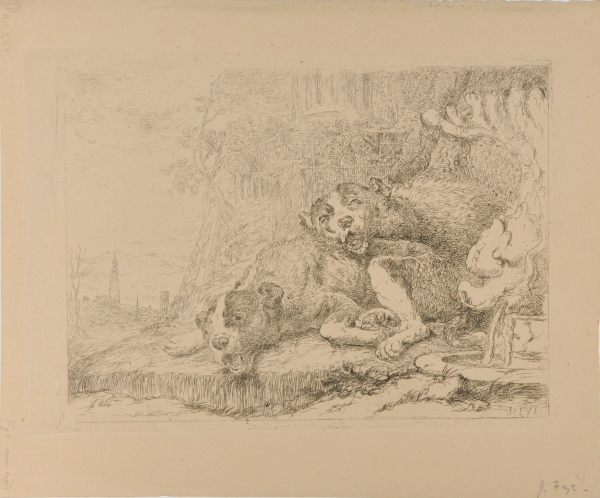 TWO LARGE DOGS LYING BY A FOUNTAIN