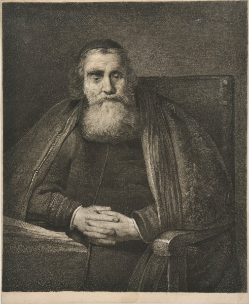 BEARDED MAN SEATED WITH HIS HANDS CLASPED