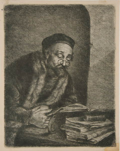 MAN WITH SPECTACLES READING A BOOK