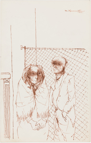 MAN AND WOMAN IN FRONT OF A FENCE
