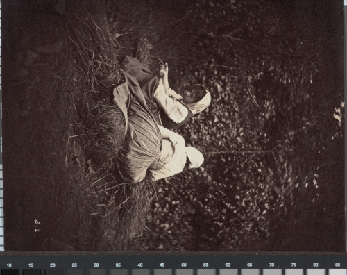 TWO PEASANT WOMEN RESTING ON BUNDLES