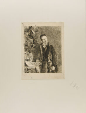 Portrait of a man with hand resting on some papers on a table