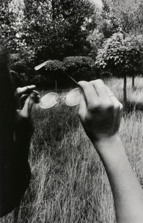 Girl Holding Glasses